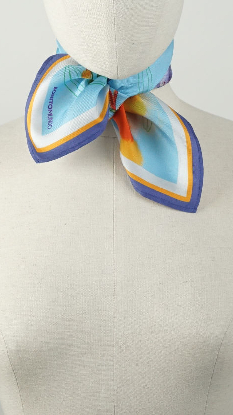 small 45 cm blue handmade natural silk scarf tied around the neck of a mannequin