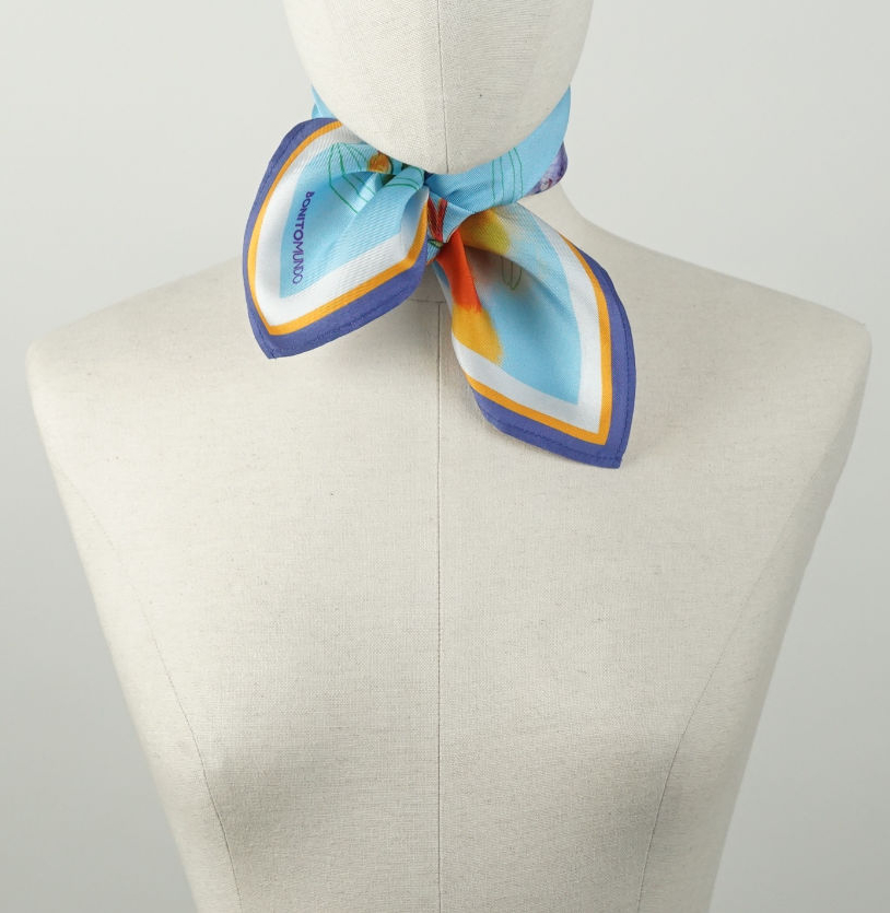 small 45 cm blue handmade natural silk scarf tied around the neck of a mannequin