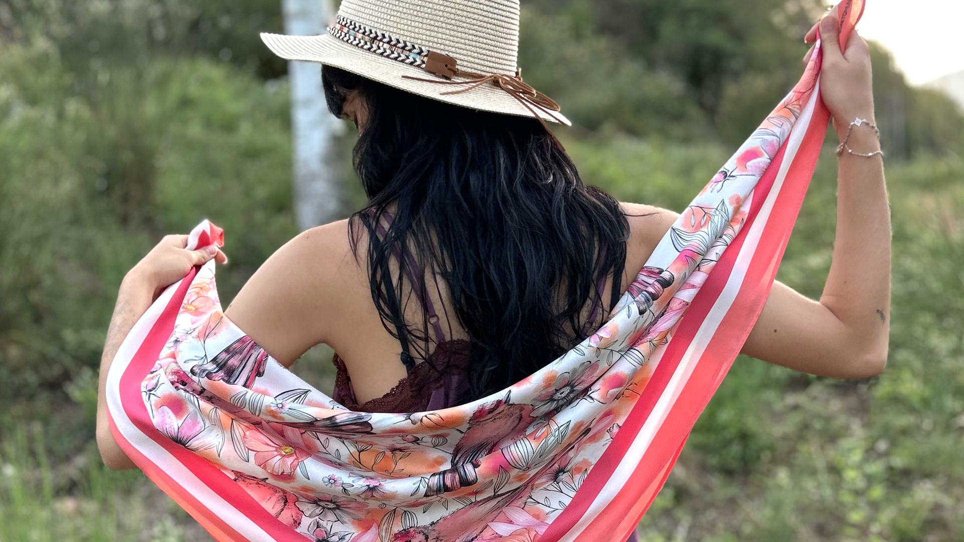 Young woman from behind with silk scarf